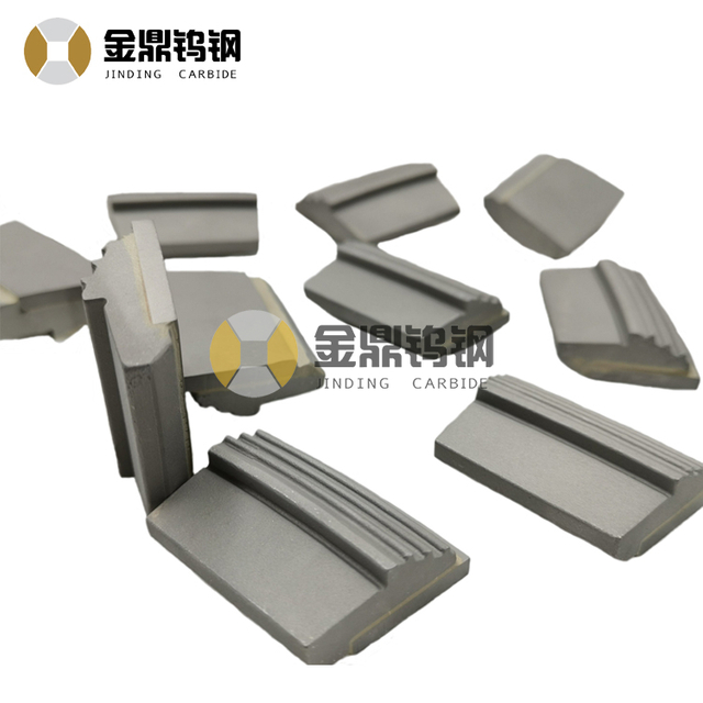 Tungsten carbide wear tiles for decanter centrifuge
