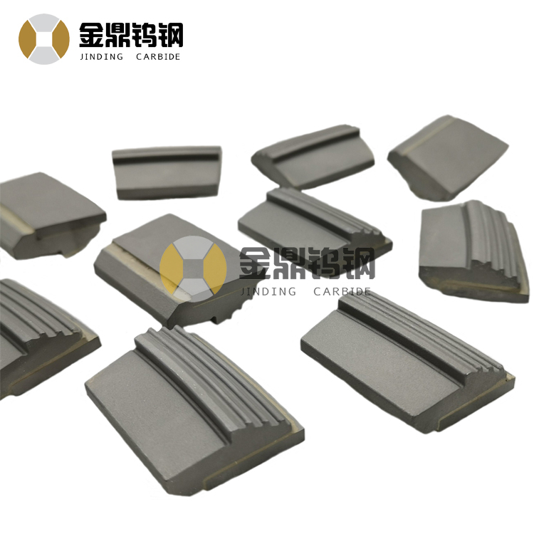 Tungsten carbide wear tiles for decanter centrifuge